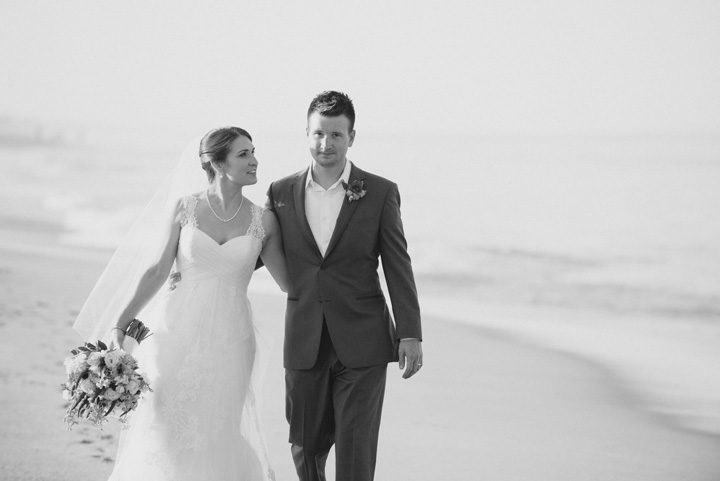 Kelly and Simon Outer Banks Wedding Bride and Groom Portrait Walking by Neil GT Photography