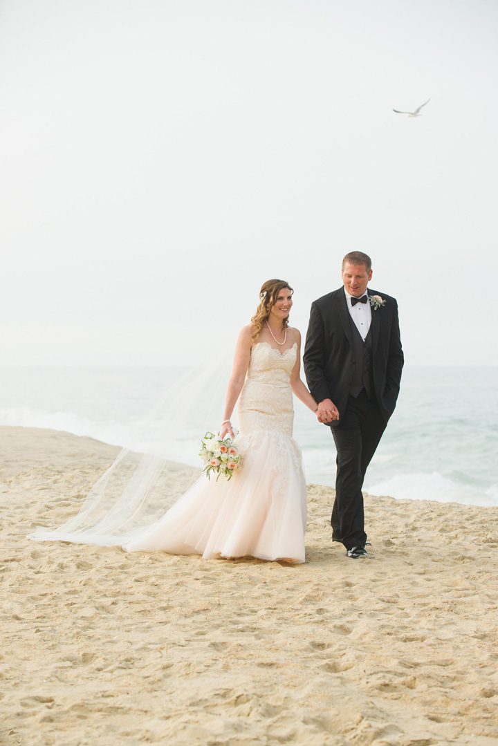 Michelle and Will Outer Banks wedding photographer Jennette's Pier walking