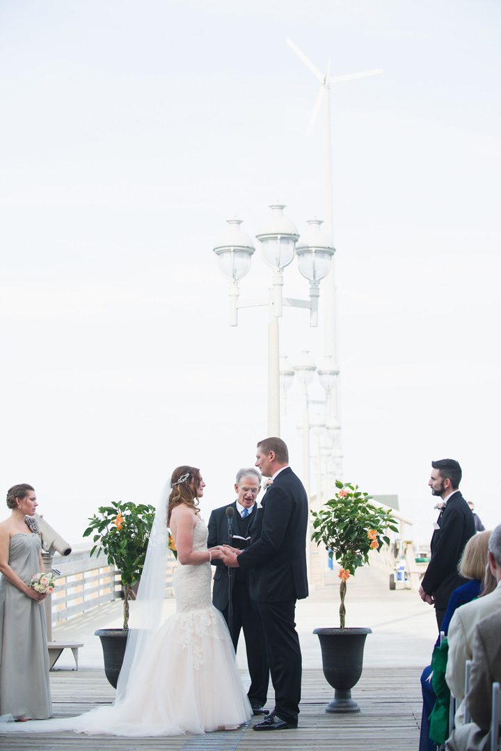 Michelle and Will Outer Banks wedding photographer Jennette's Pier ceremony vert