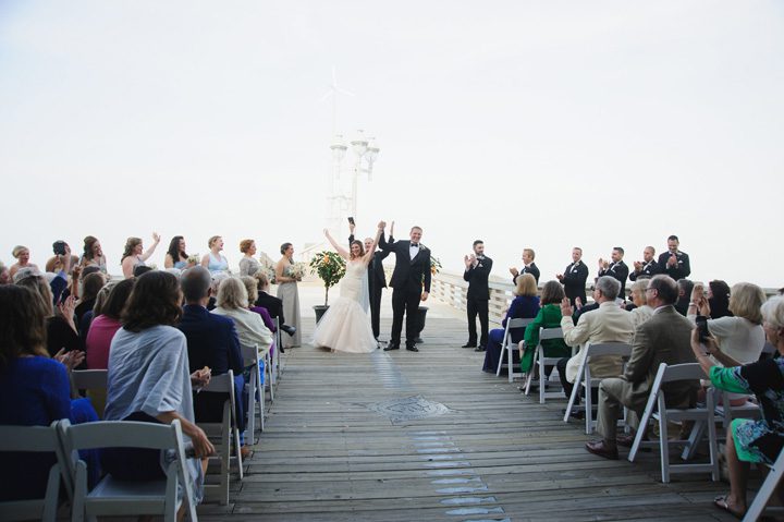 Michelle and Will Outer Banks wedding photographer Jennette's Pier ceremony announcement
