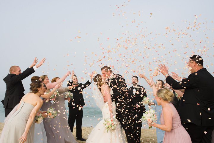 Michelle and Will Outer Banks wedding photographer Jennette's Pier petals throw