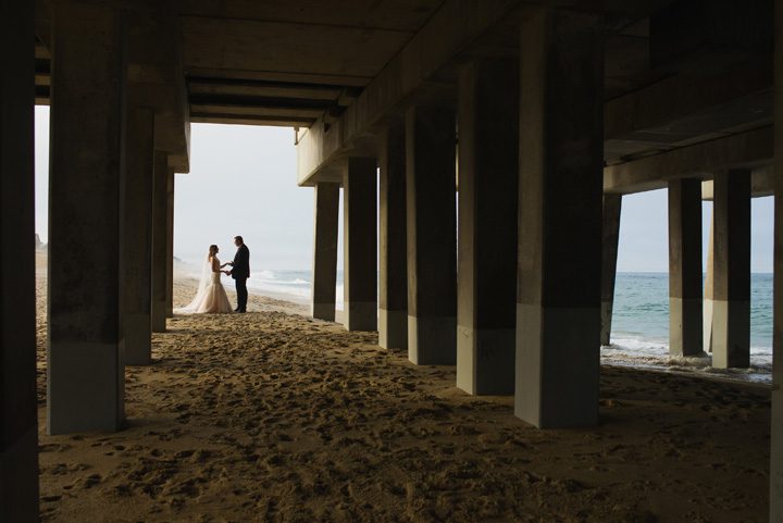 Michelle and Will Outer Banks wedding photographer Jennette's Pier under wide