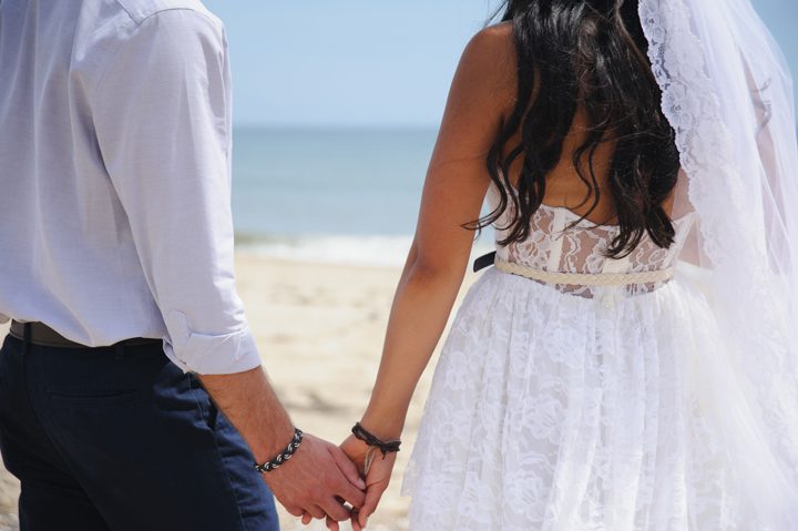 Morgan and Wesley Outer Banks Elopement Wedding by Neil GT Photography Beach Holding Hands