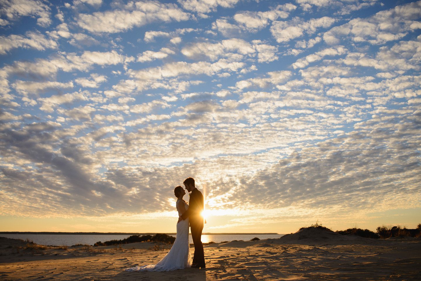 Sanctuary Vineyards Outer Banks Jockey's Ridge wedding photographer by Neil GT Photography sunset clouds