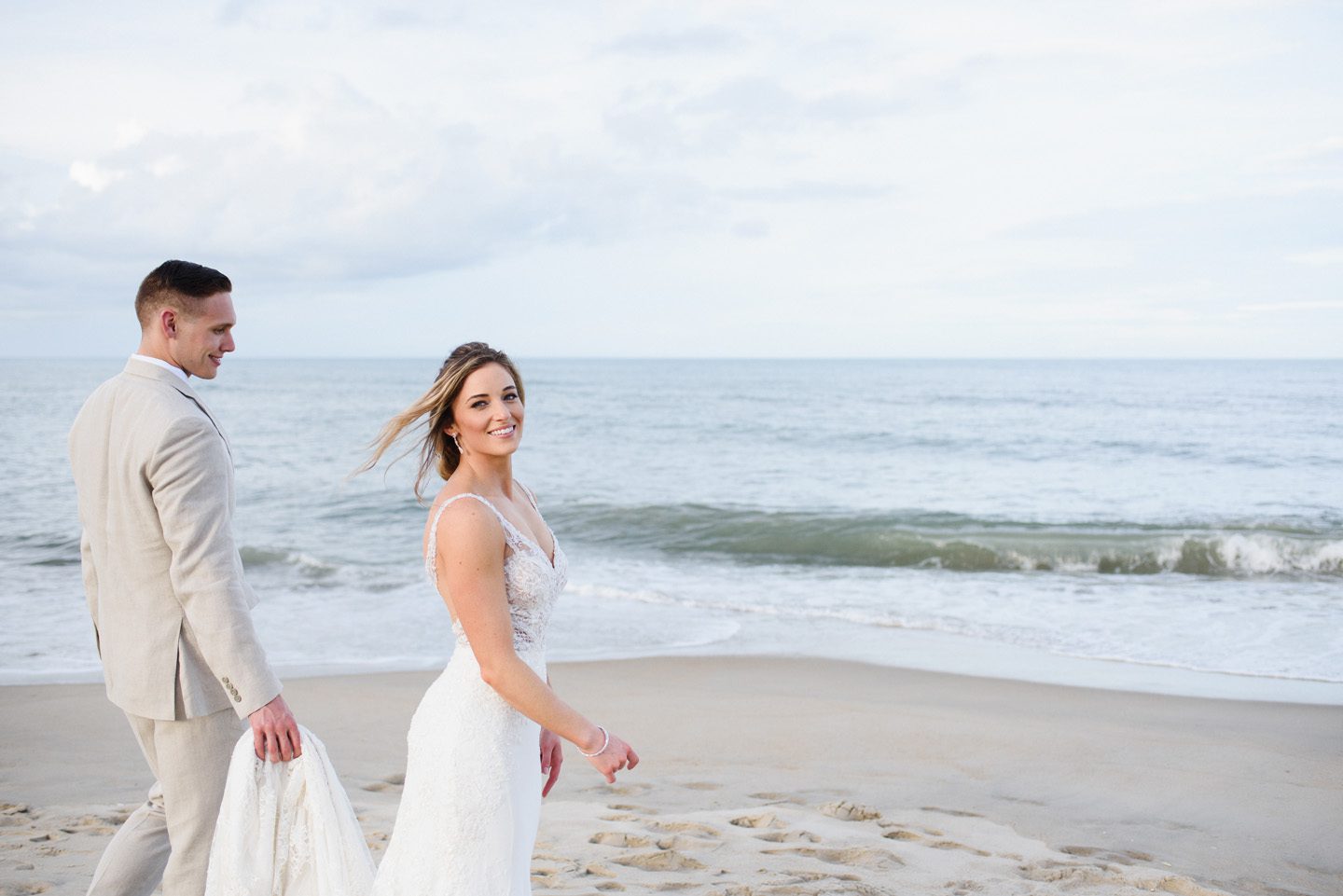 Outer Banks Wedding Photographers Neil GT Photography Palmers Island Beach Elopement Carrying Dress