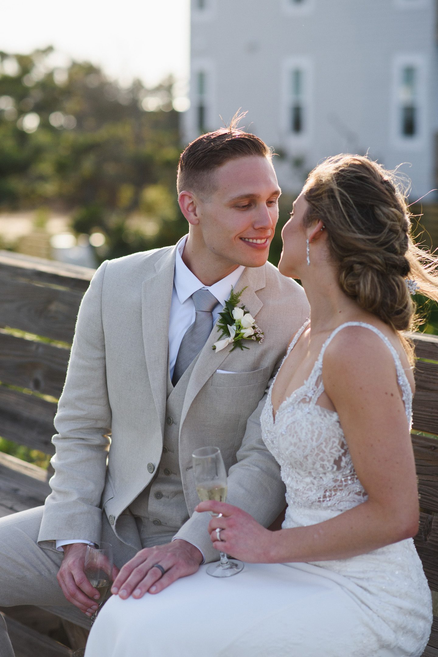 Outer Banks Wedding Photographers Neil GT Photography Palmers Island Beach Elopement Champagne Toast Kiss