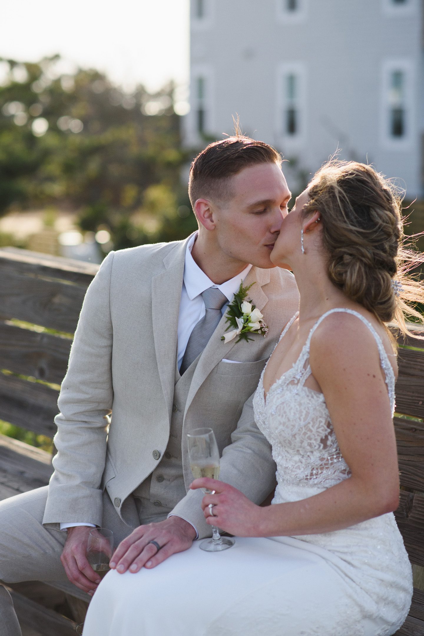 Outer Banks Wedding Photographers Neil GT Photography Palmers Island Beach Elopement Champagne Toast Kiss