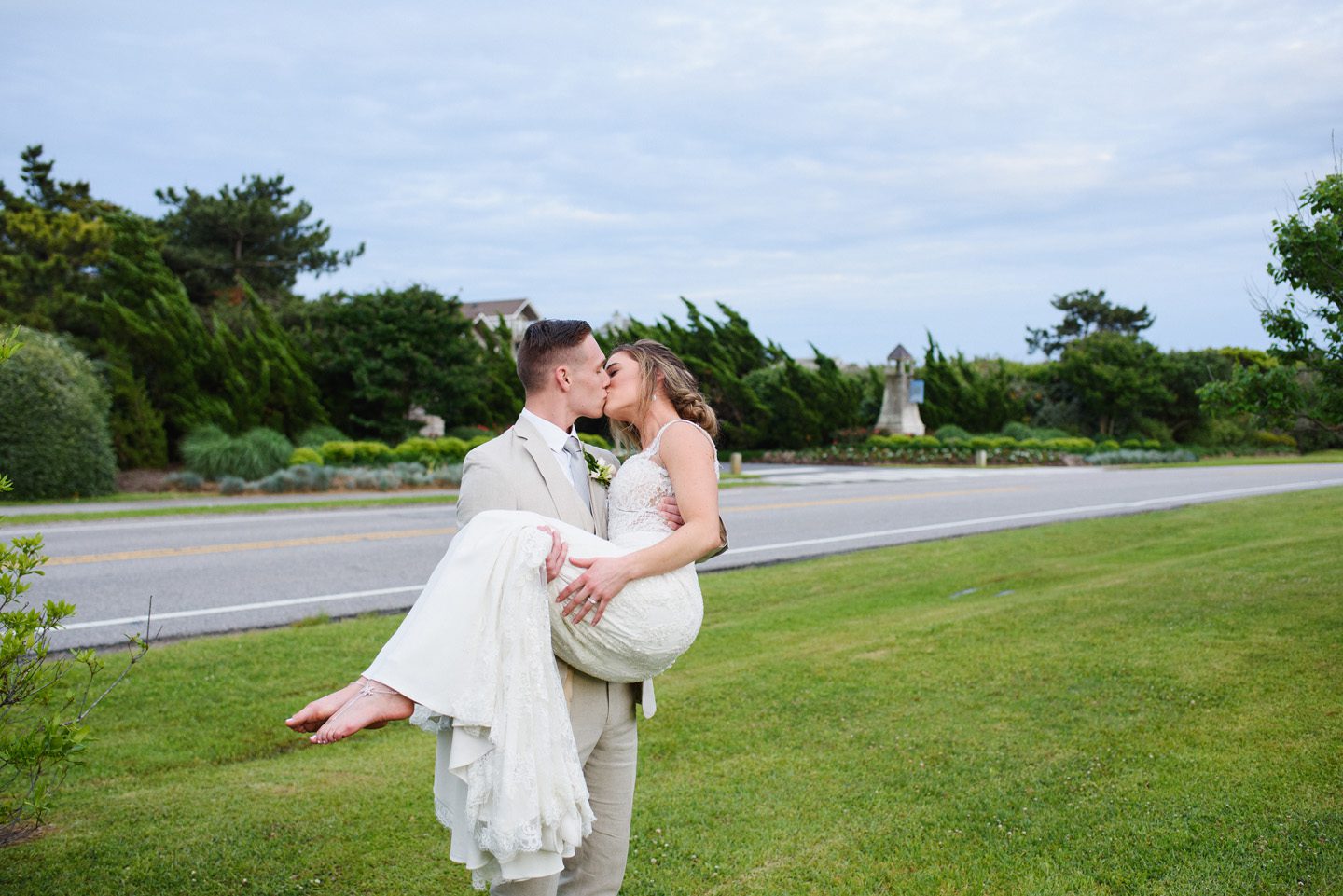 Outer Banks Wedding Photographers Neil GT Photography Palmers Island Beach Elopement Carry Bride Kiss