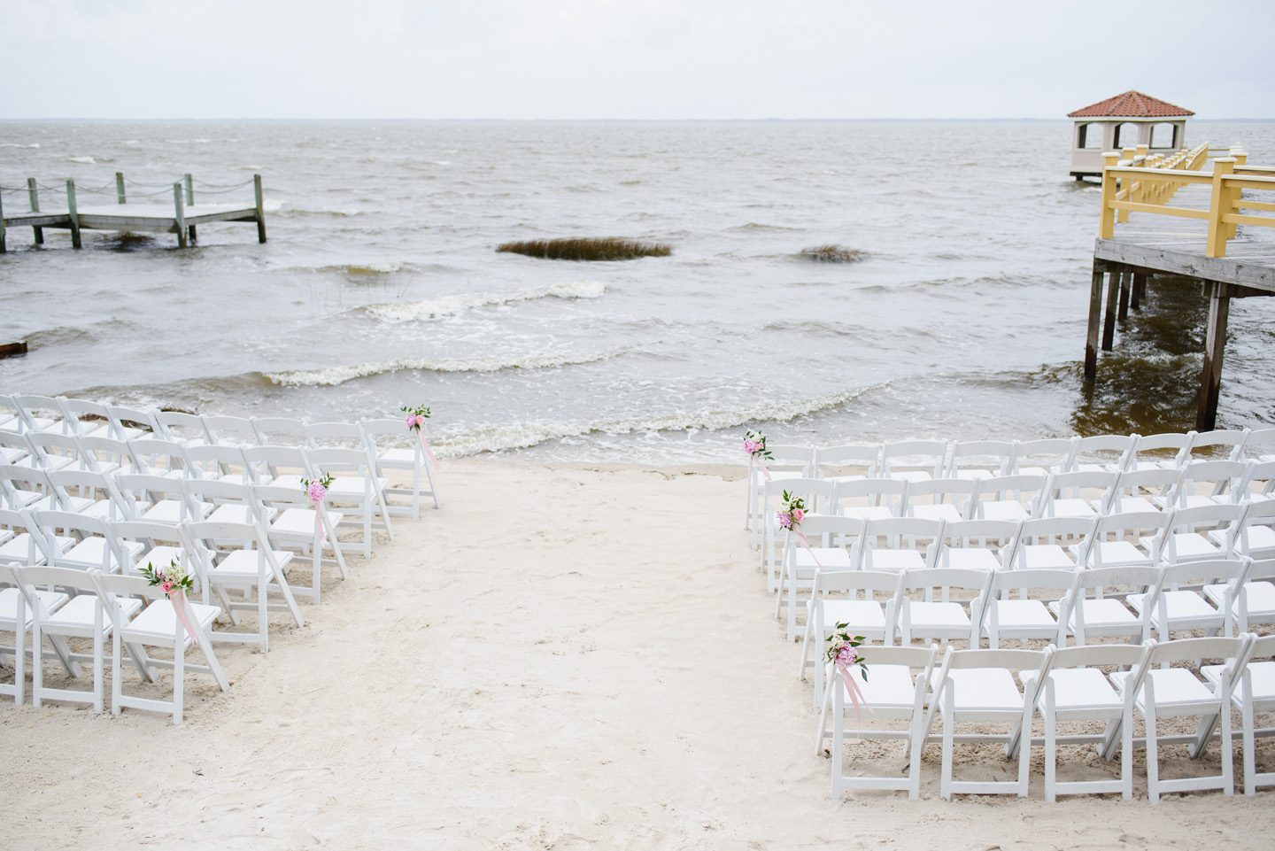 Outer Banks Wedding at the Grade Ritz Palm Photographers Neil GT Photography Ceremony Chairs