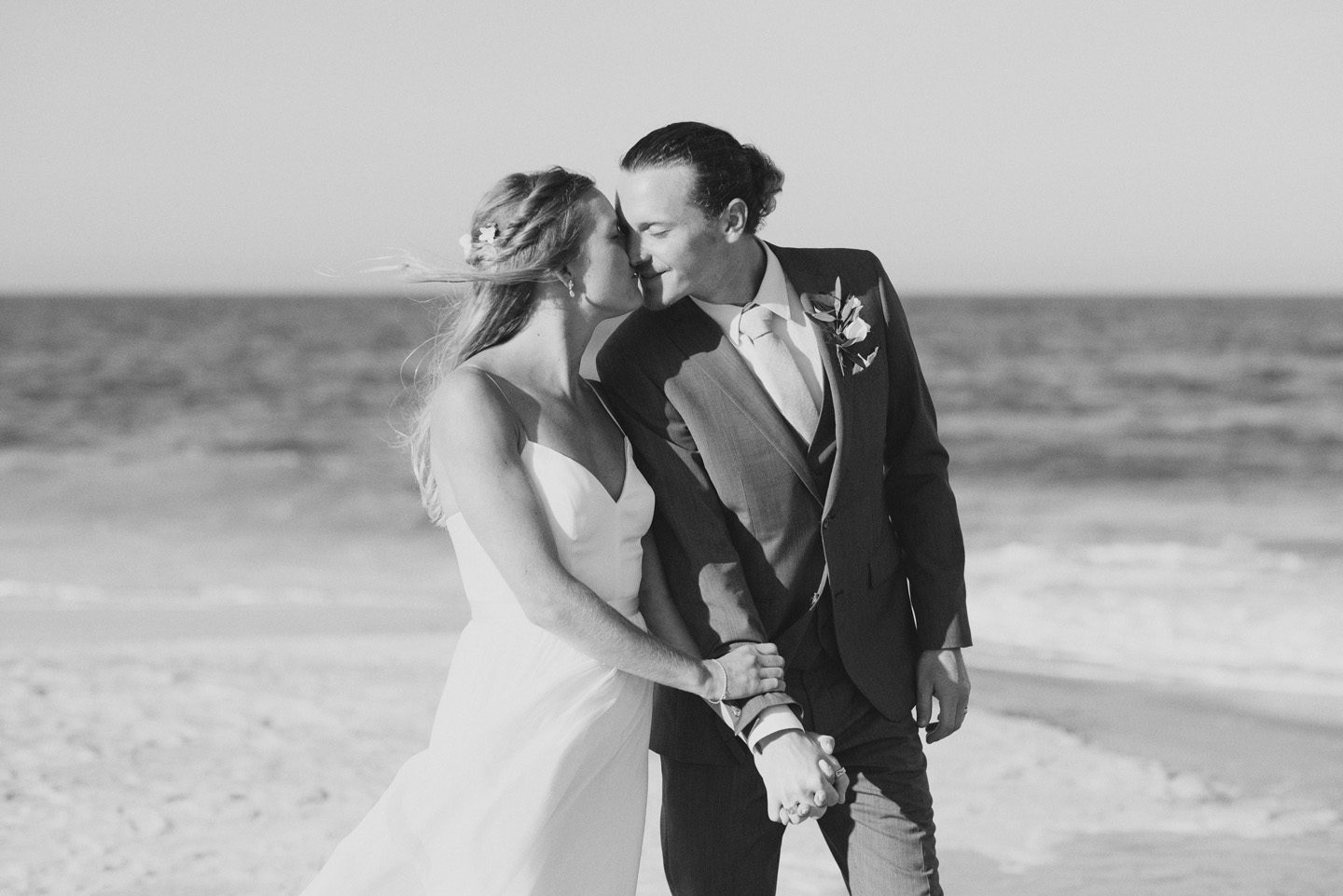 Bride and Groom Walk Together with Photographer Outer Banks Wedding at Sound to Sea Beach Club