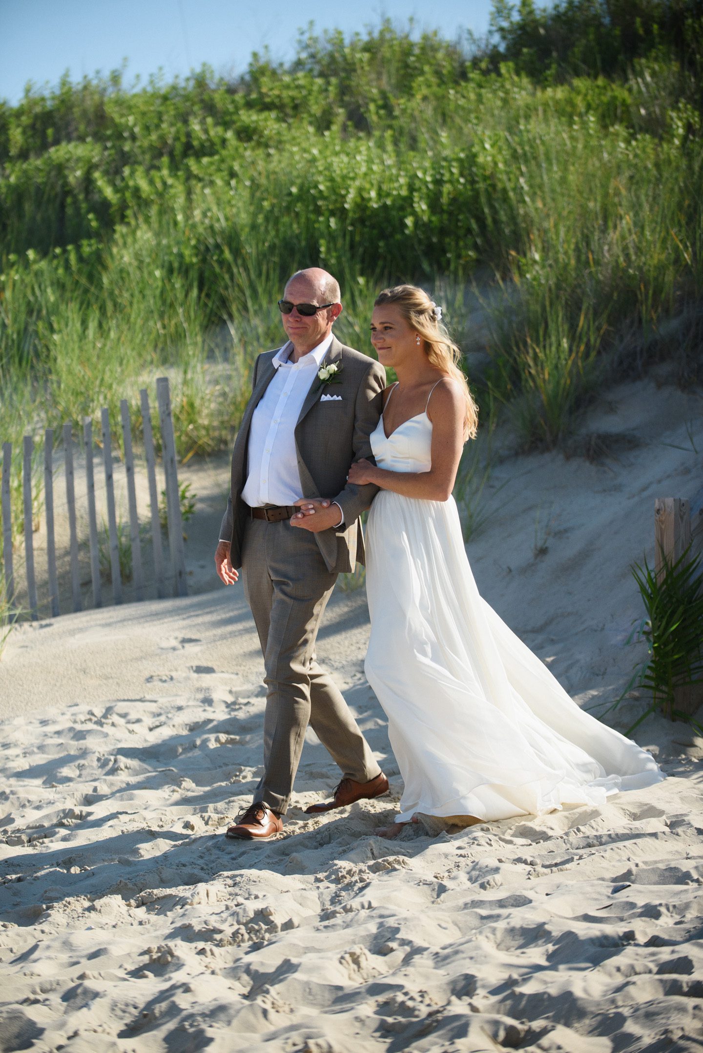 Bride Enters Wedding Ceremony Photography by Neil GT Photography at Outer Banks Wedding at Sound to Sea Beach Club