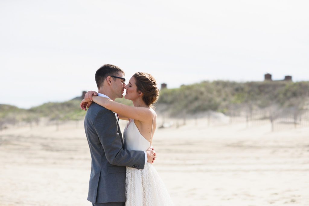 Portrait of bride and groom together on a Nags Head beach