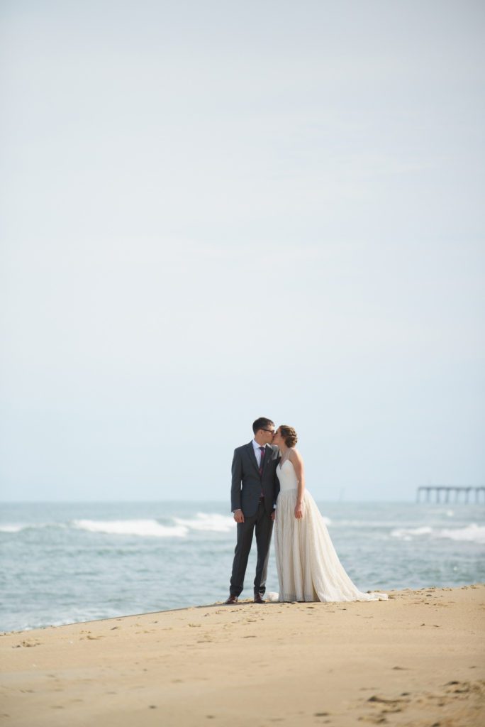 Bride and Groom kiss by the ocean in Nags Head
