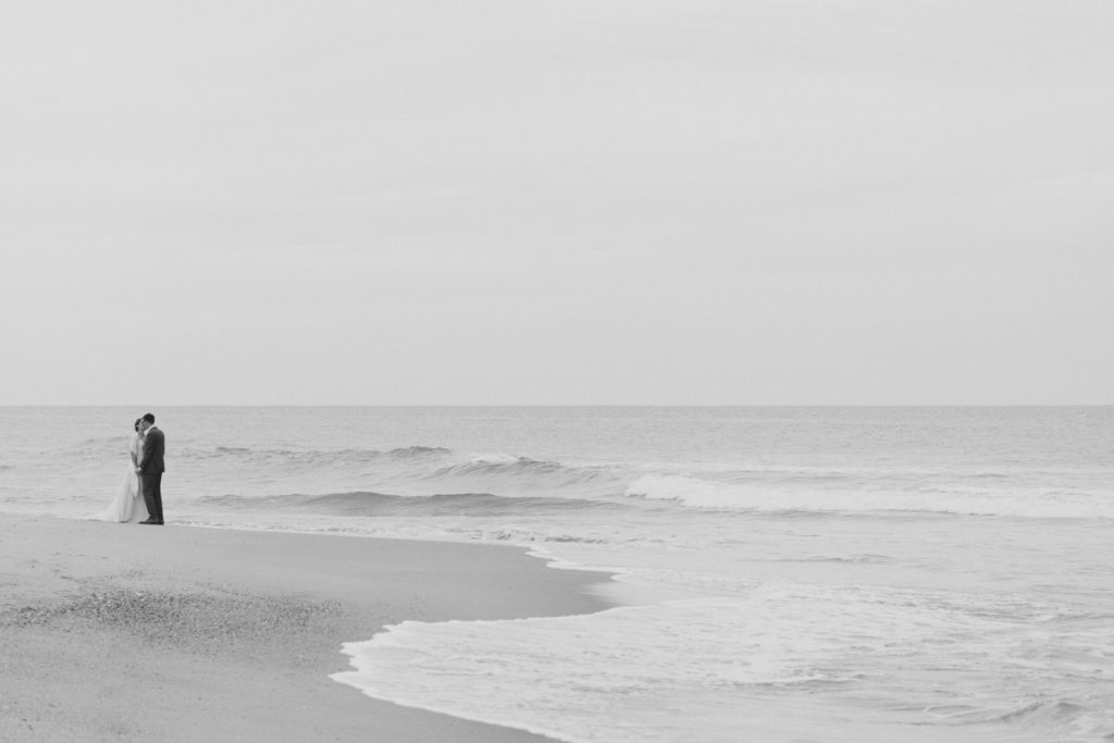 wedding portrait on the beach at sunset