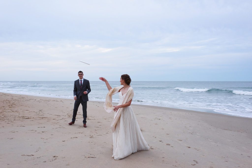 Frisbee on the beach at an Outer Banks wedding