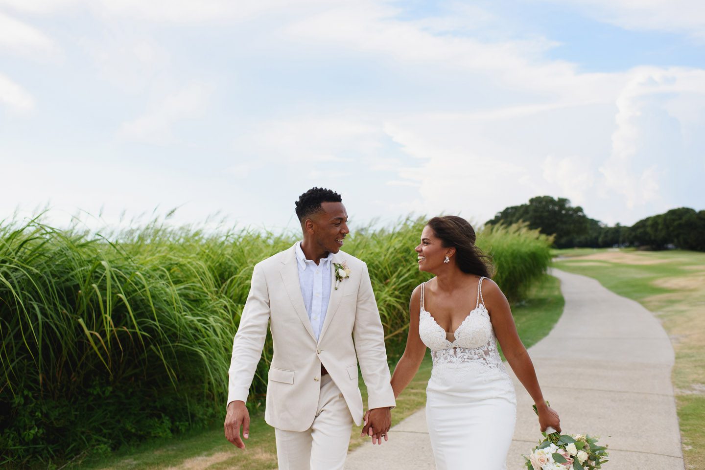 Couple walking together at their Currituck Club wedding