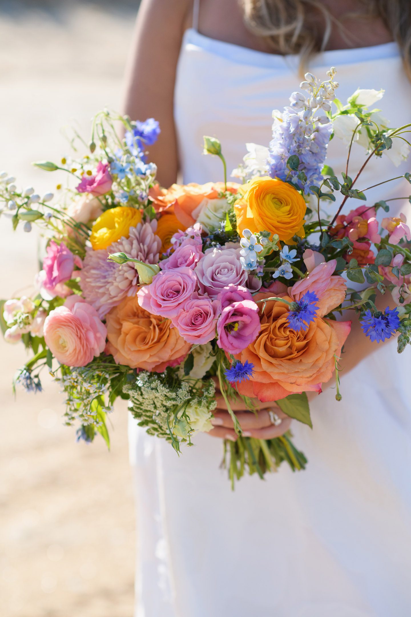 Colorful spring wedding bouquet by Flower Girls OBX