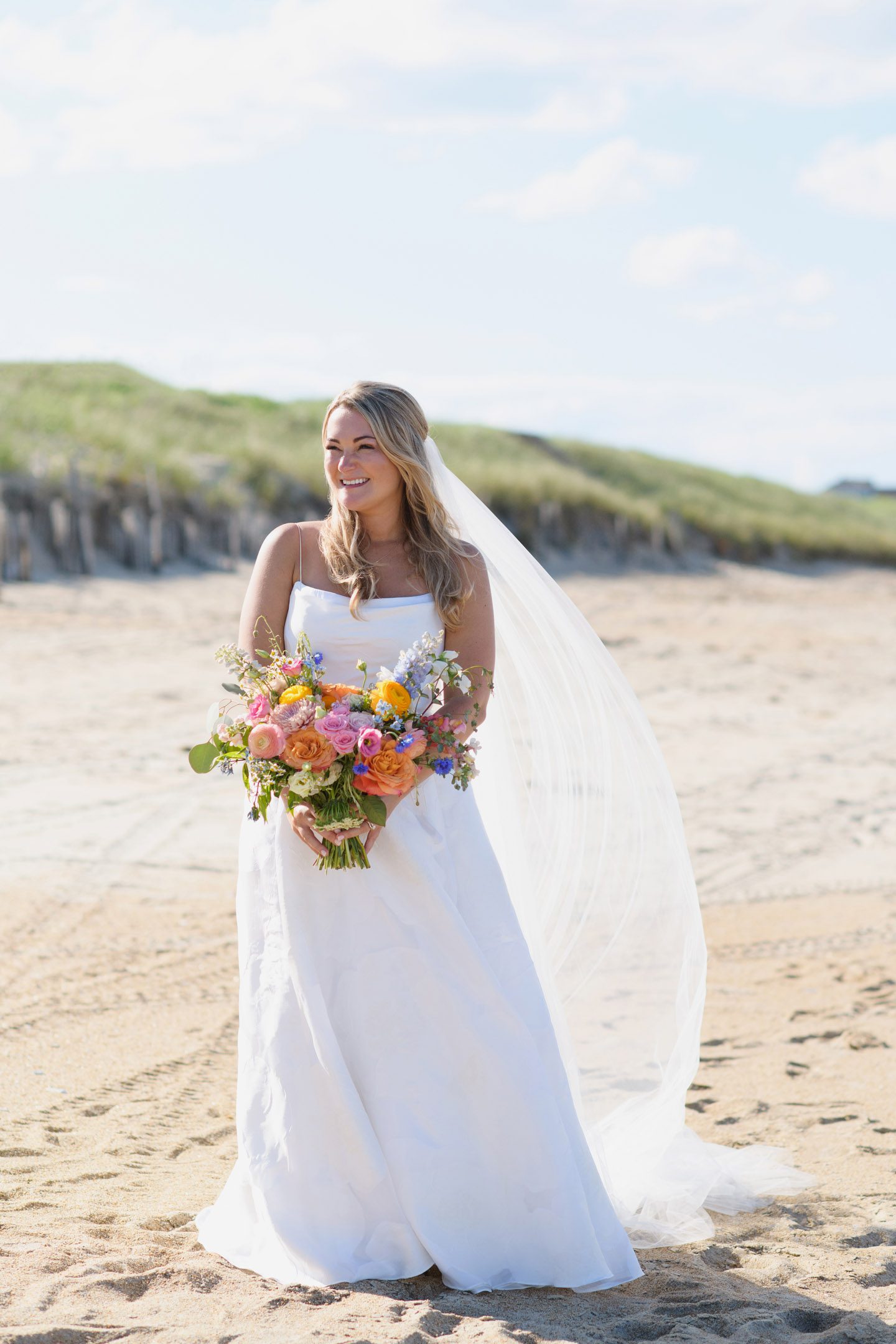Bride portrait with colorful spring florals on the Outer Banks