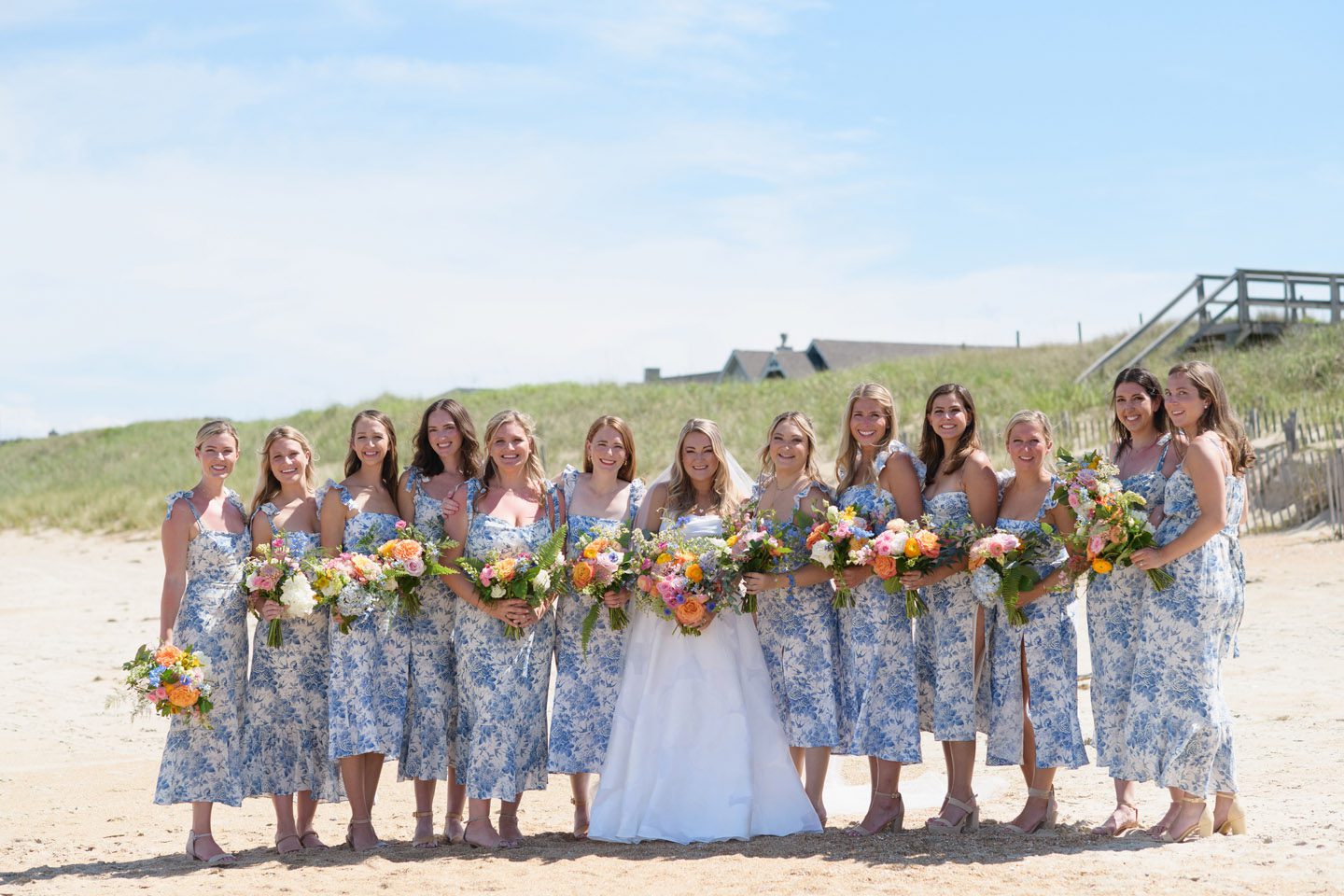 Wedding party bridesmaids with colorful spring florals at the Sanderling Resort