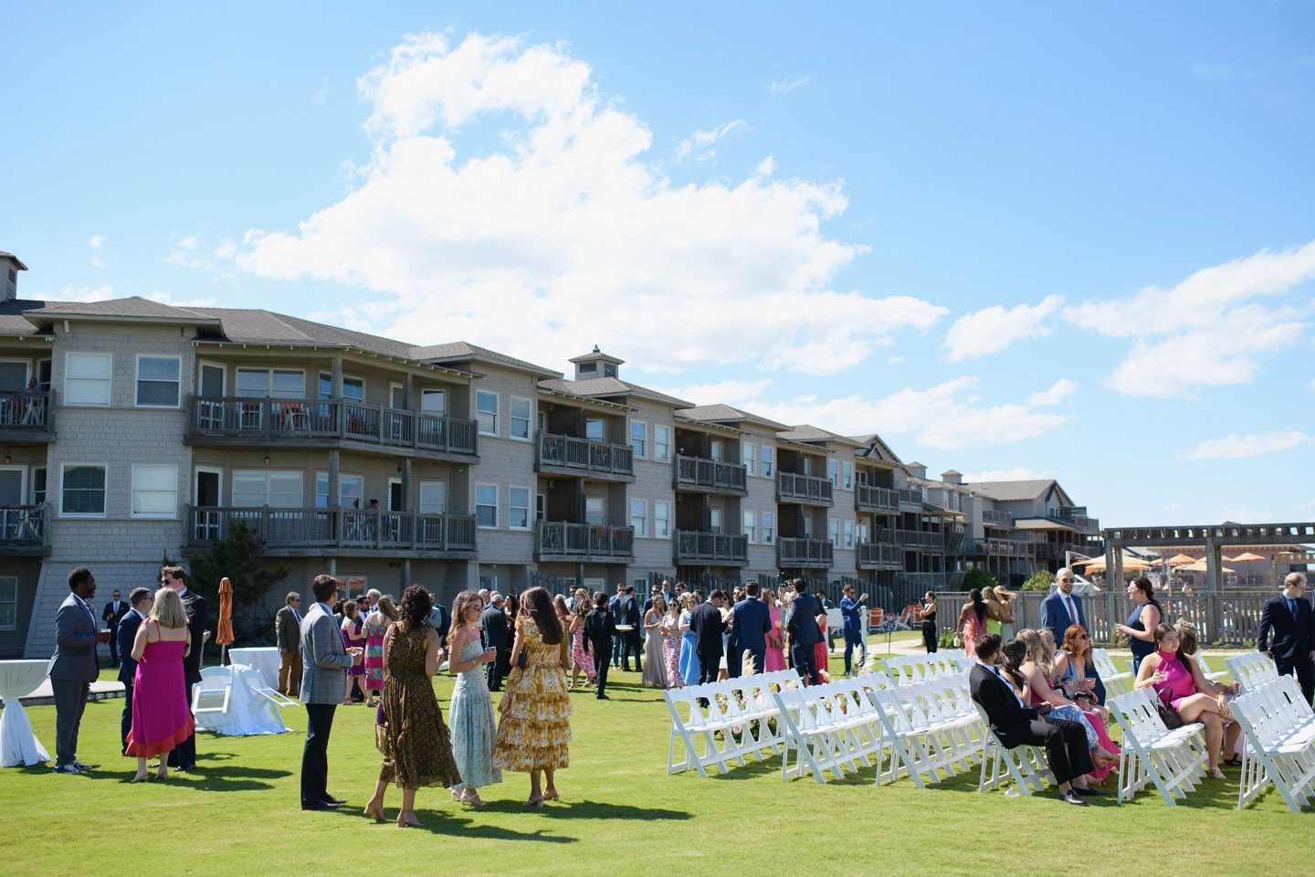 Wedding guests gather before the ceremony at the Sanderling Resort