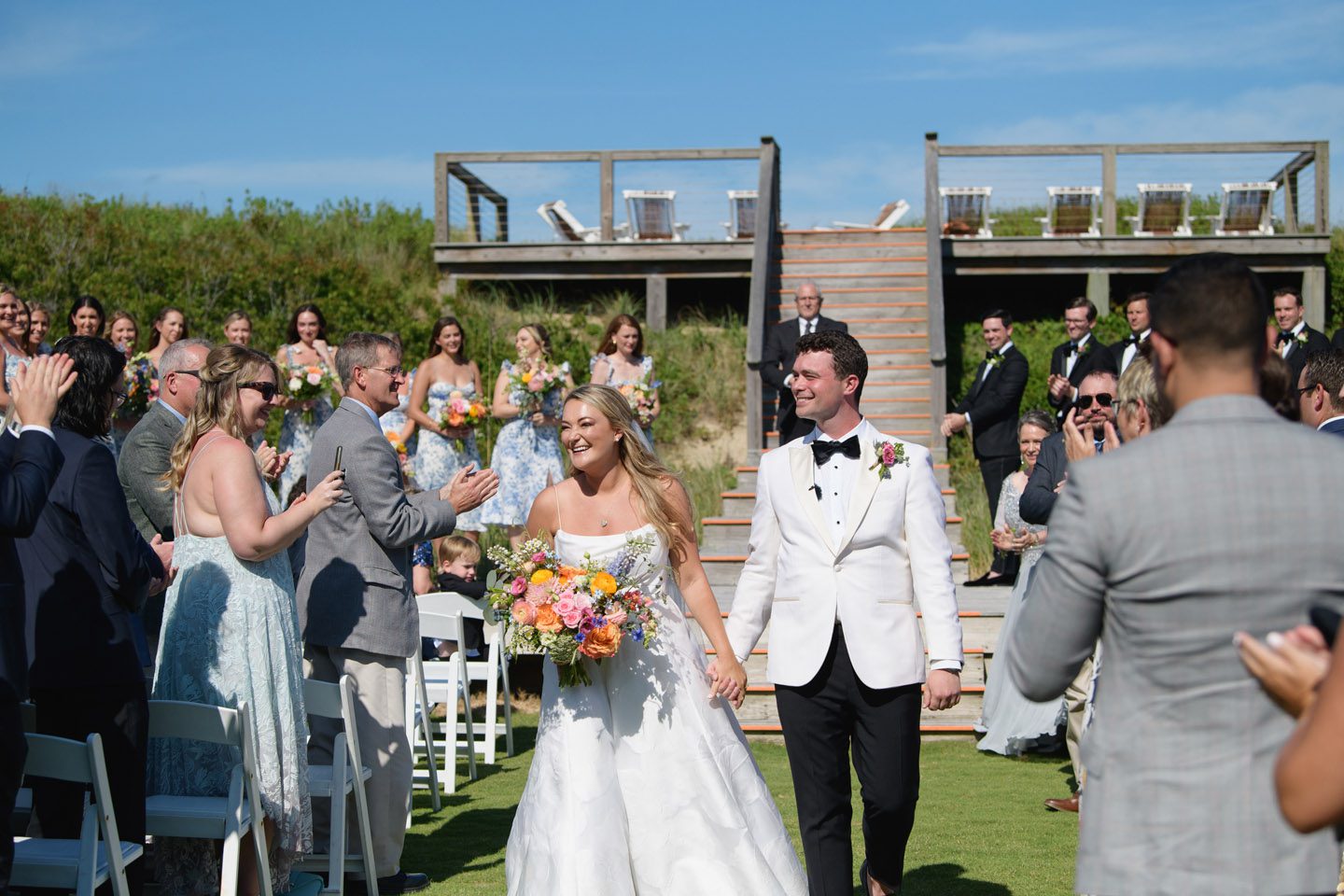 Bride and Groom walking down the aisle at their Outer Banks wedding