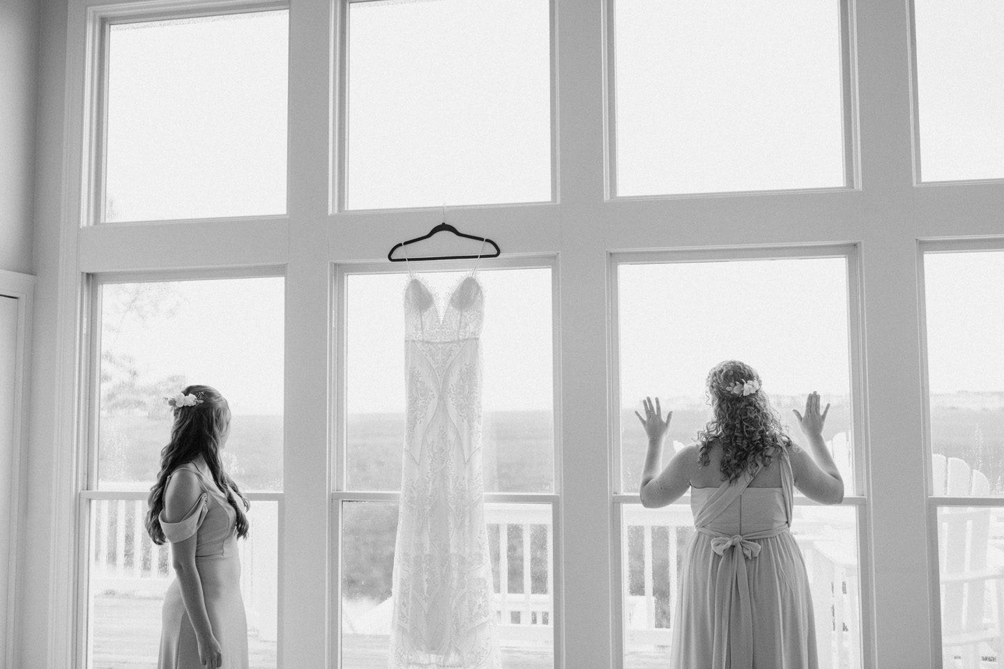 Outer Banks wedding at Festival Park in Manteo bridesmaids look out on a rainy day