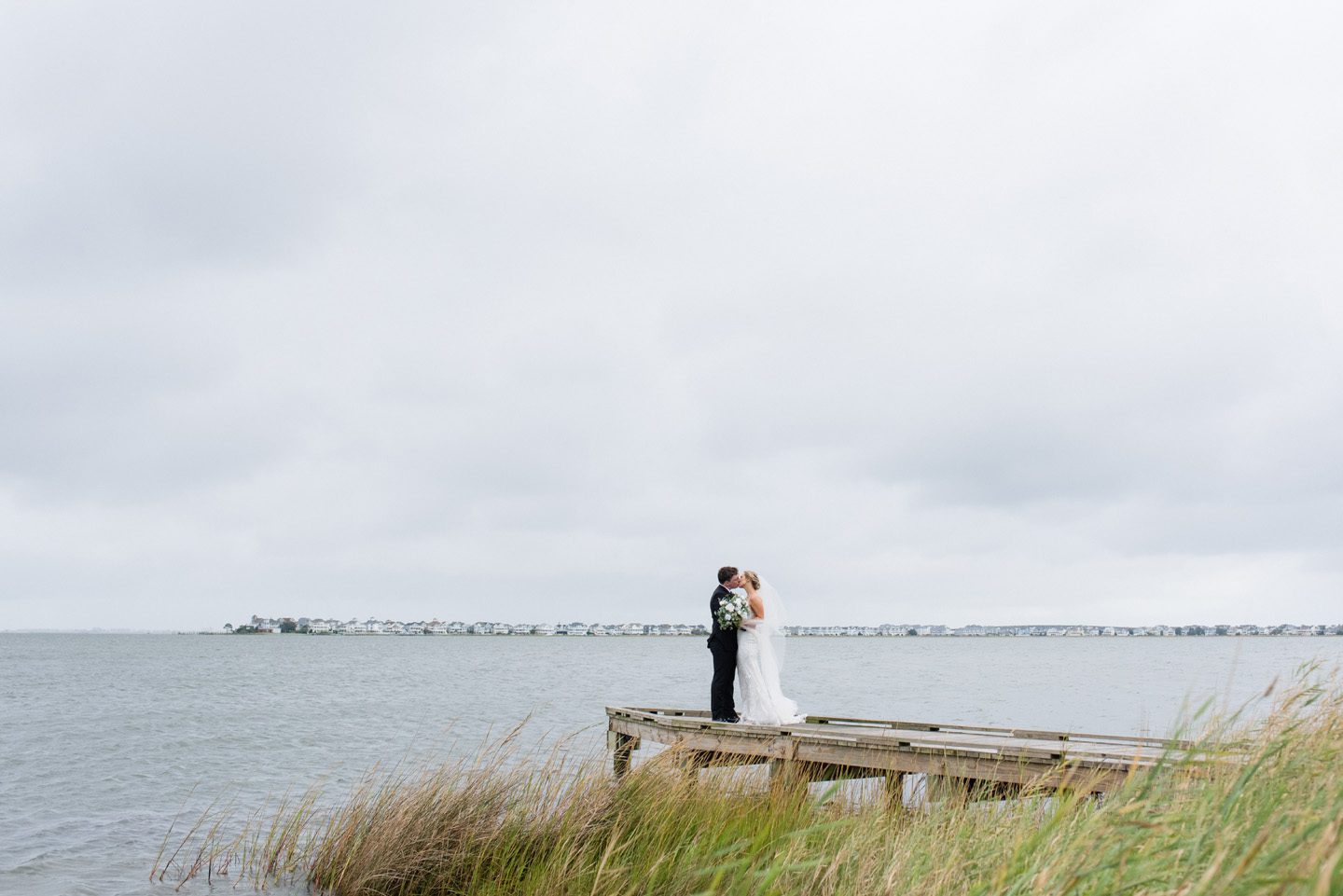 Wedding first look on the waterfront at Festival Park in Manteo