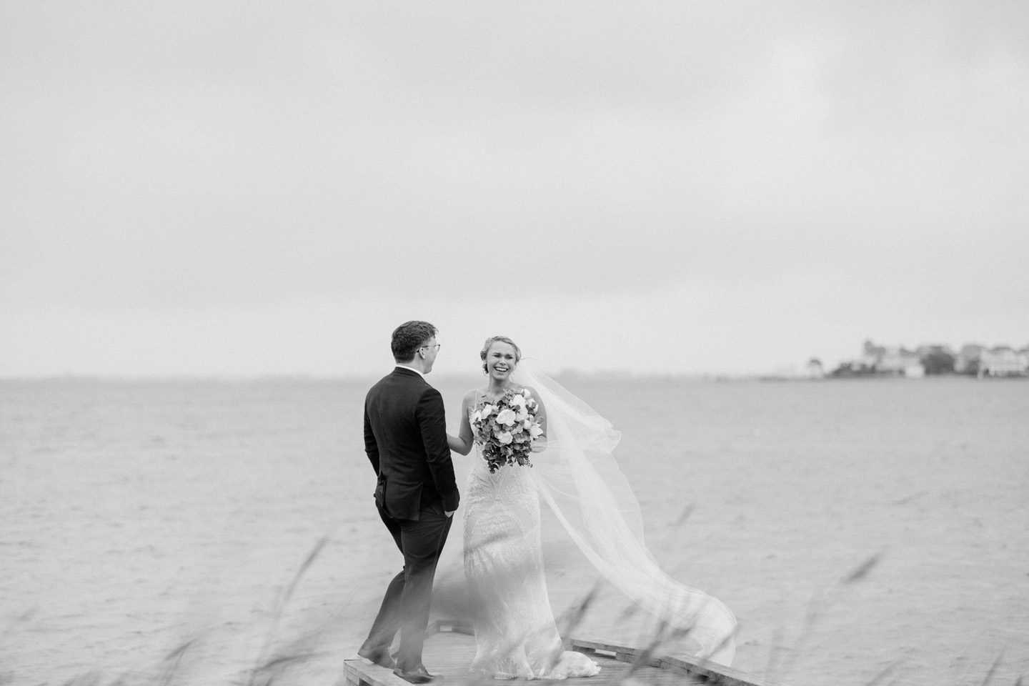 Wedding first look on the waterfront at Festival Park in Manteo